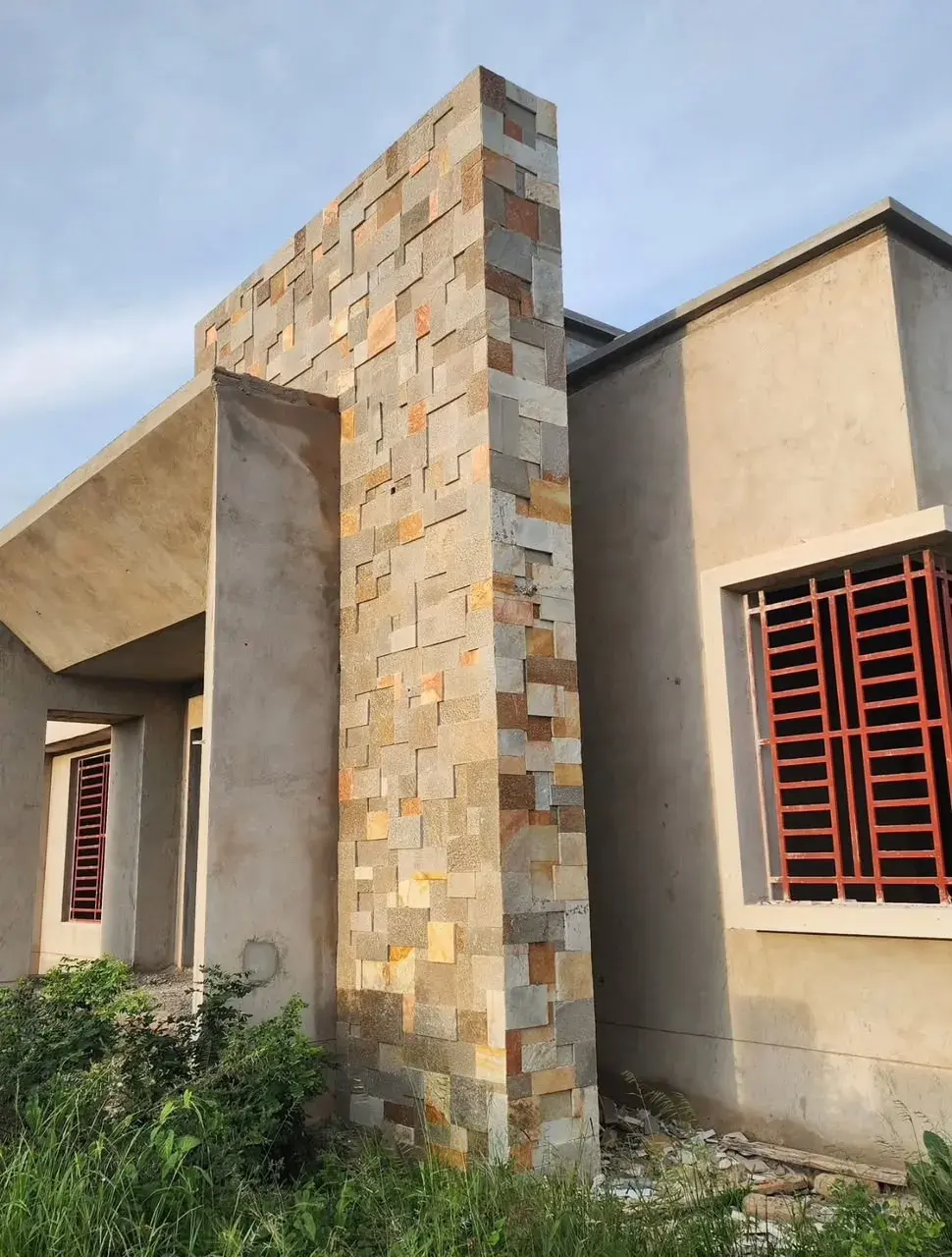 Babati stone column on a house facade