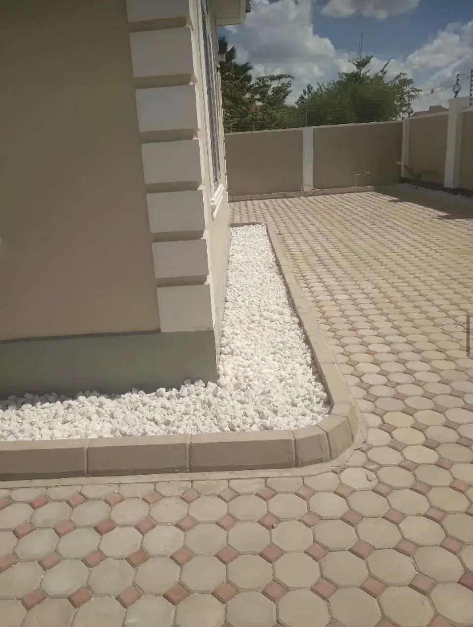 White stone border around a house