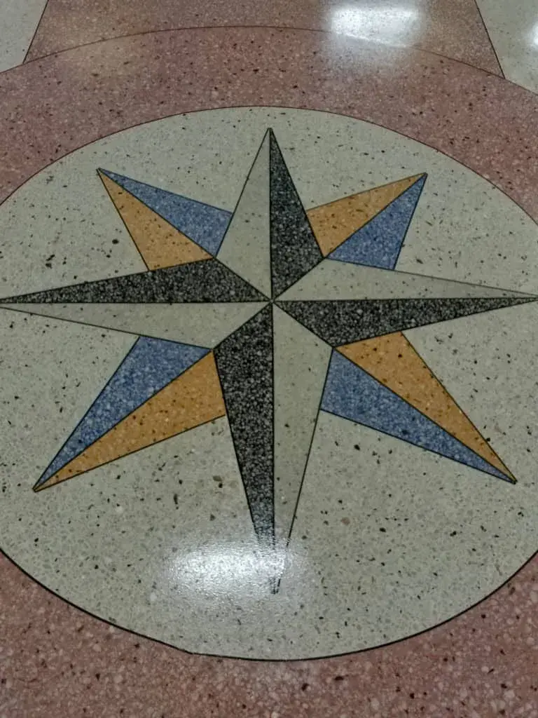 Terrazzo compass star in blue, gold and black