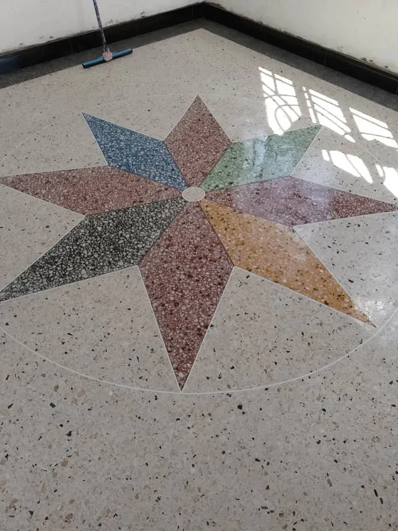 Polished terrazzo floor with a multicoloured eight-point star