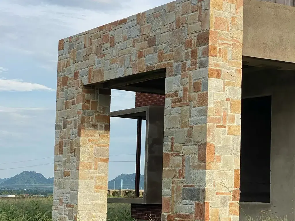 Entrance frame clad in Babati stone