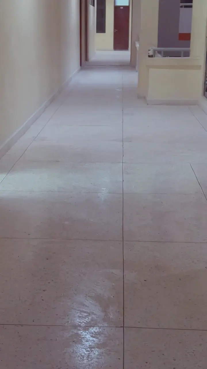 Light terrazzo corridor floor with reflections, DIT, Dar es Salaam